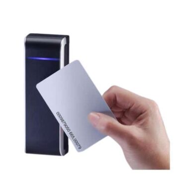 Hand holding an RFID access card near a black card reader for secure entry.
