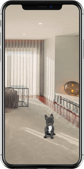 martphone screen showing a security app in a living room. A small black and white dog walks across the carpet while the camera view follows the movement, demonstrating the pet-friendly motion detection feature.